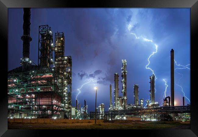 Lightning Bolts striking over Oil Refinery Framed Print by Arterra 