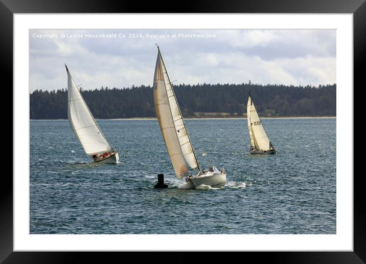 A sailing yacht rounds a buoy in a close sailing r Framed Mounted Print by Louise Heusinkveld