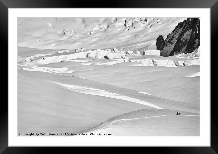 Two climbers crossing the Glacier Geant Framed Mounted Print by Colin Woods