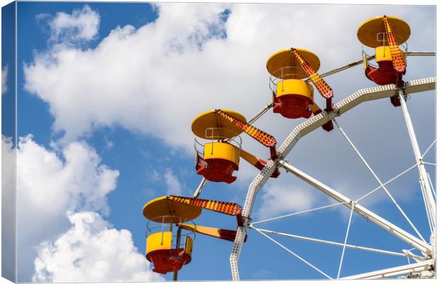 Giant Ferris Wheel In Fun Park On Blue Sky Canvas Print by Radu Bercan