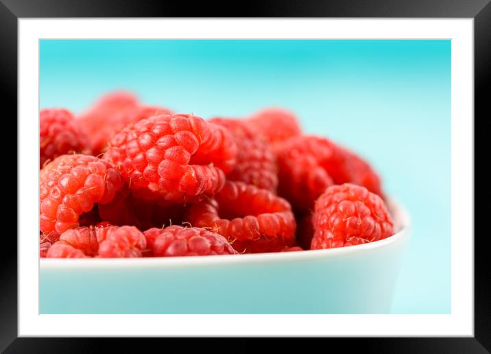 White Bowl Of Red Fresh Raspberries Framed Mounted Print by Radu Bercan