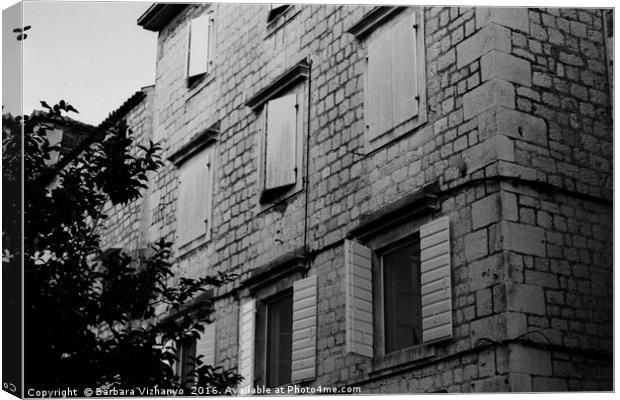 Black and white building with windows and shutters Canvas Print by Barbara Vizhanyo