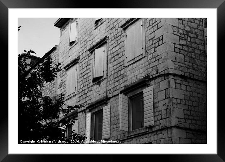 Black and white building with windows and shutters Framed Mounted Print by Barbara Vizhanyo