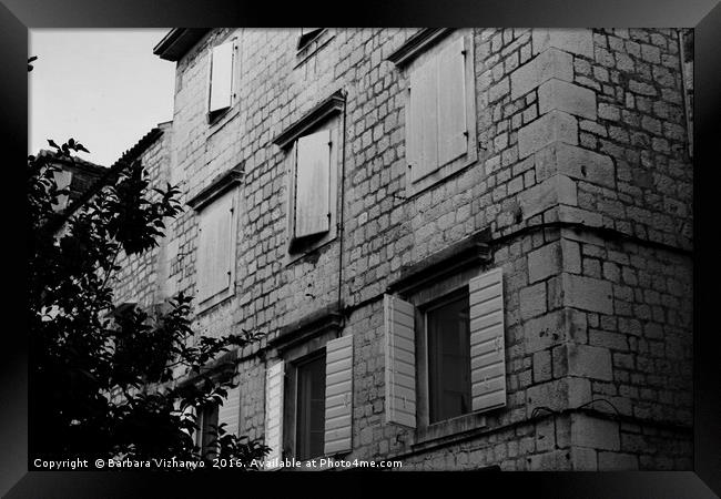 Black and white building with windows and shutters Framed Print by Barbara Vizhanyo