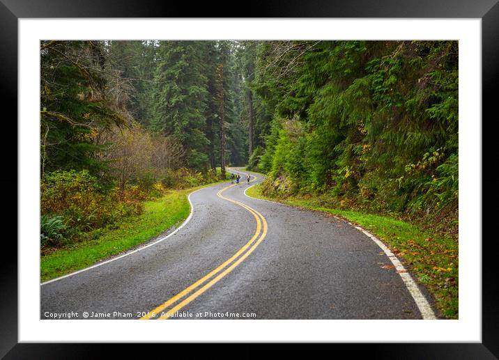 Hikers walking along a deserted road in the Hoh Ra Framed Mounted Print by Jamie Pham