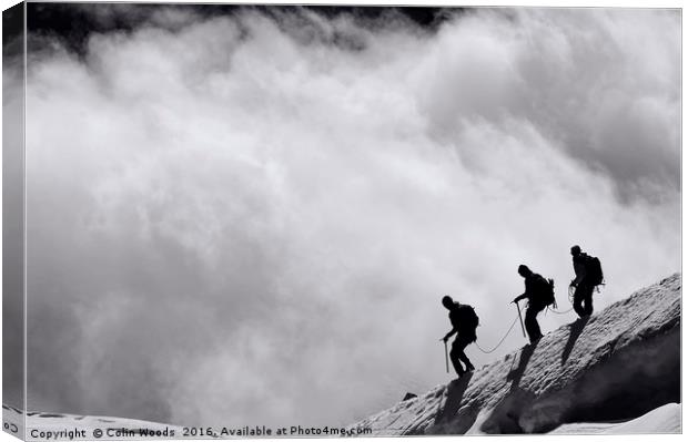 Climbers descending into the clouds Canvas Print by Colin Woods