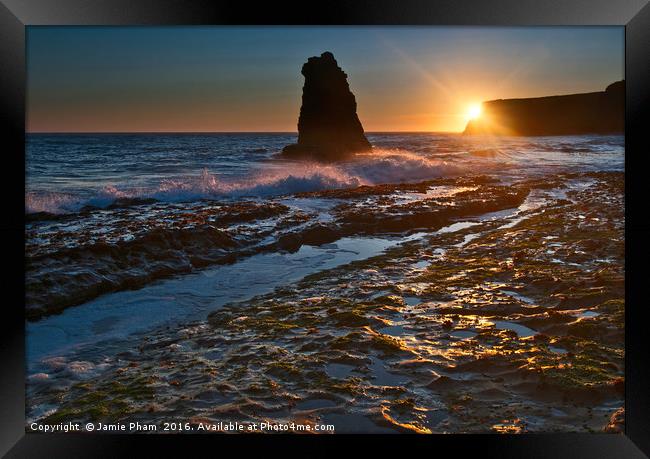 Dramatic view of a sea stack in Davenport Beach, S Framed Print by Jamie Pham