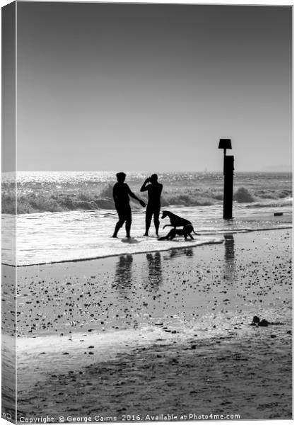 Family playing in the sea Canvas Print by George Cairns