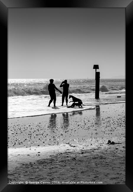 Family playing in the sea Framed Print by George Cairns