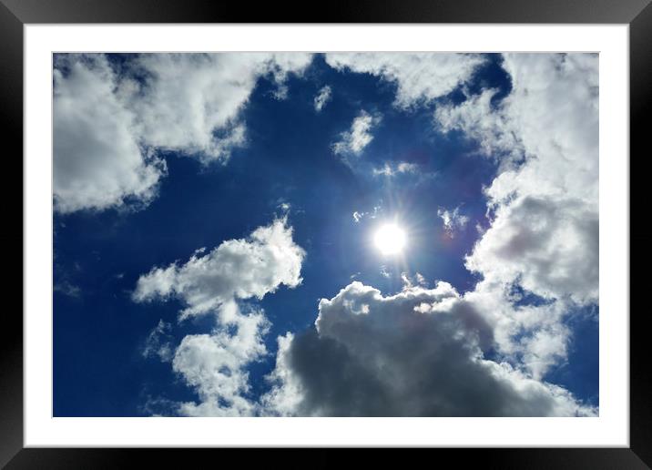 sun and clouds Framed Mounted Print by Marinela Feier