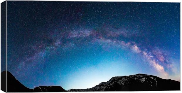 Milky Way galaxy over mountains Canvas Print by Ragnar Lothbrok