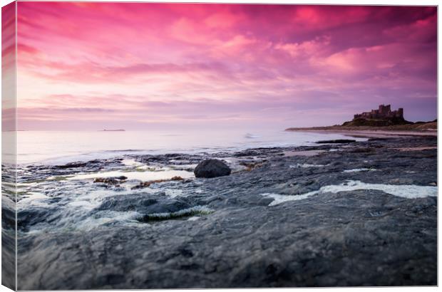 Sunrise at Bamburgh Castle Canvas Print by Anthony Simpson