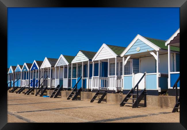 Beach huts in blue and white Framed Print by Kevin Snelling
