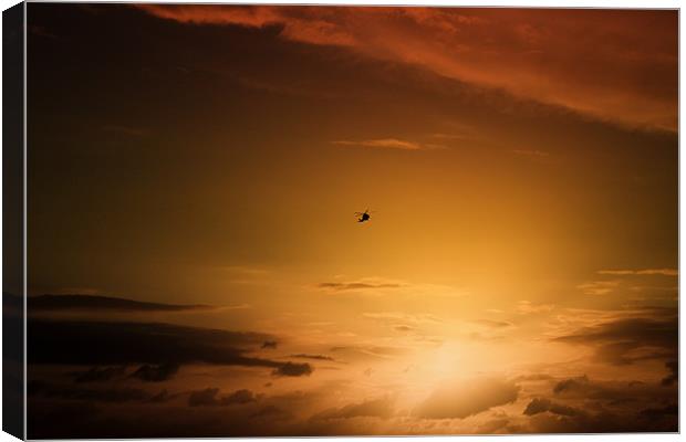 Helicopter at sunset Canvas Print by Ian Jeffrey