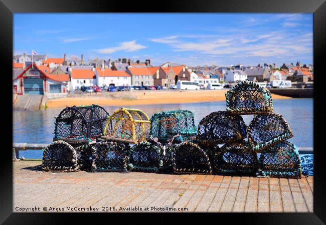 Lobster pots on quayside at Anstruther Framed Print by Angus McComiskey