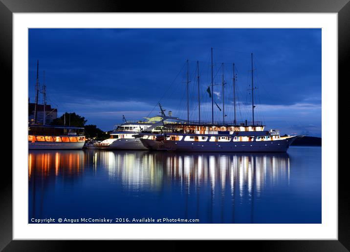 Cruise ships at anchor Framed Mounted Print by Angus McComiskey