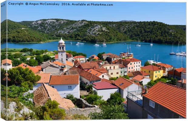 Red tiled rooftops of Skradin Canvas Print by Angus McComiskey