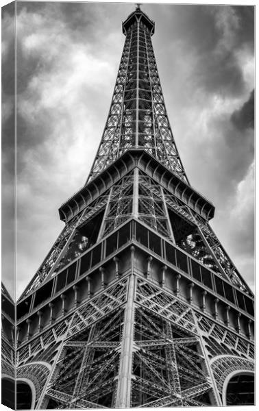 Low angle view of the Eifel Tower on a cloudy day Canvas Print by George Cairns