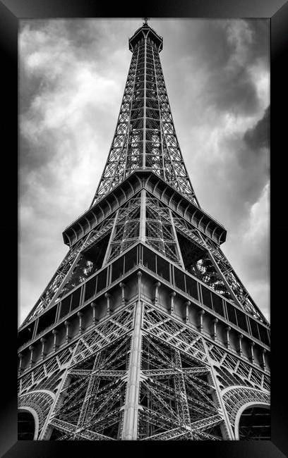 Low angle view of the Eifel Tower on a cloudy day Framed Print by George Cairns