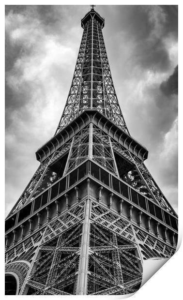 Low angle view of the Eifel Tower on a cloudy day Print by George Cairns