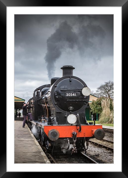 HORSTED KEYNES, UK - MARCH 19, 2016: Driver climbs Framed Mounted Print by George Cairns
