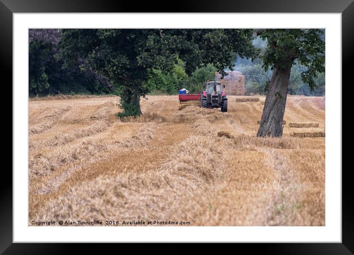 Baling straw Framed Mounted Print by Alan Tunnicliffe