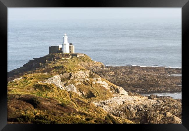 The Mumbles Lighthouse at Bracelet Bay Swansea  Framed Print by Nick Jenkins