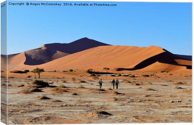 Figures in a desert landscape Canvas Print by Angus McComiskey