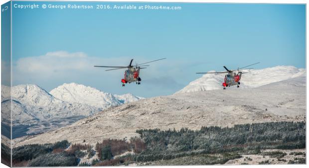 Helicopters Two Rescue Sea Kings flying near Ben L Canvas Print by George Robertson