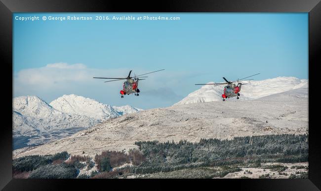 Helicopters Two Rescue Sea Kings flying near Ben L Framed Print by George Robertson