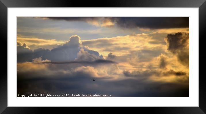 Microlight in a Stormy Sky Framed Mounted Print by Bill Lighterness