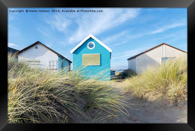 Blue & White Beach Huts Framed Print by Helen Hotson