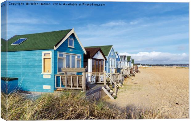 Vibrant Luxury Beach Huts at Mudeford Spit Canvas Print by Helen Hotson