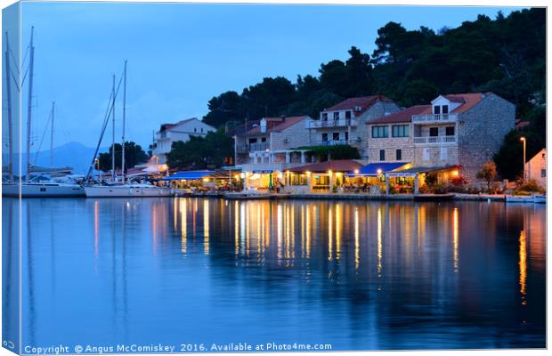 Pomena harbour at dusk Canvas Print by Angus McComiskey