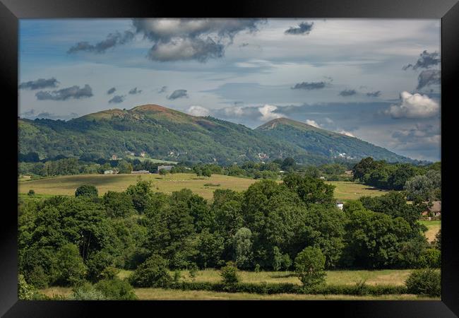 The Malvern Hills from Birtsmorton Common Framed Print by Sue Dudley