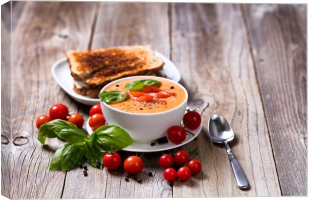 Fresh bowl of creamy tomato soup and sandwich with Canvas Print by Thomas Baker