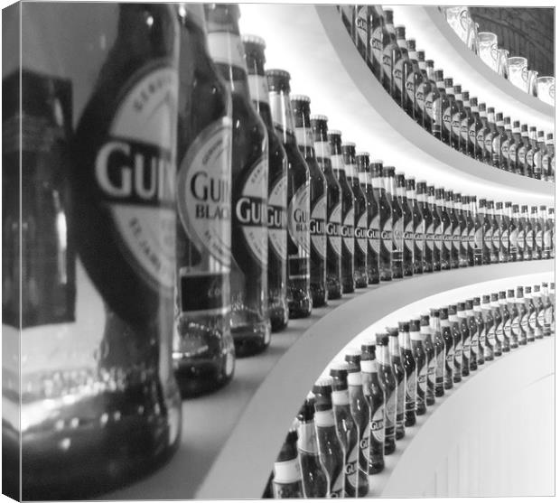 GUINNESS BOTTLES Canvas Print by Anthony Kellaway