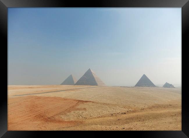 Pyramids on the Giza Plateau  Framed Print by Jackie Davies