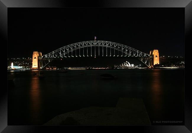 Sydney Bridge by night Framed Print by Nigel Coomber