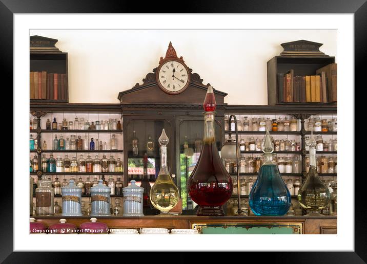 At The Apothecary Framed Mounted Print by Robert Murray