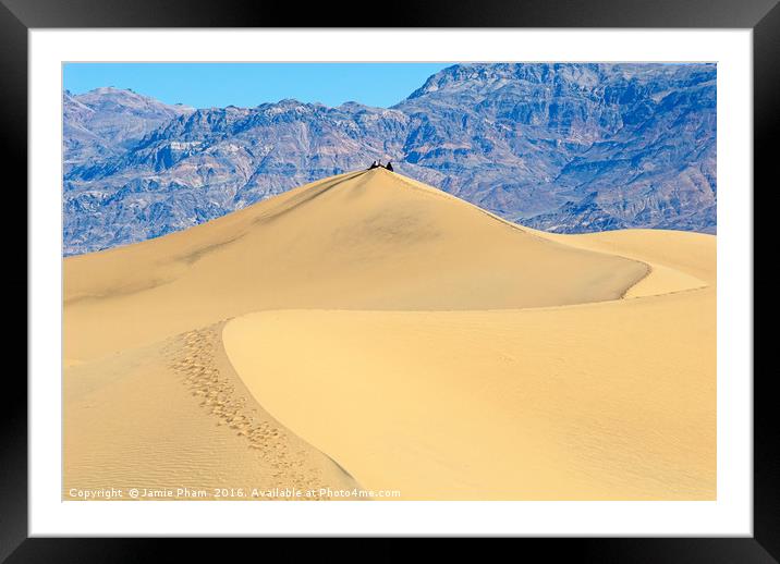 People sitting on top of a large sand dune in Deat Framed Mounted Print by Jamie Pham