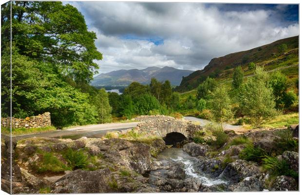 Ashness Bridge over small stream in Lake District Canvas Print by Steve Heap