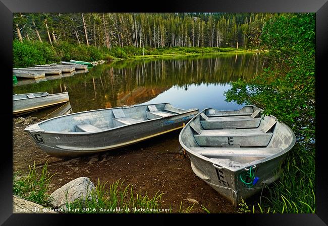 Row Boats lining a lake Framed Print by Jamie Pham