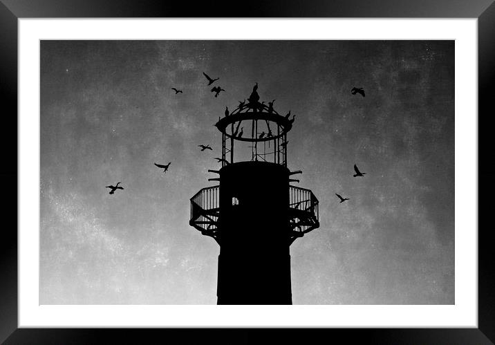 Lighthouse at sunset in silhouette  Framed Mounted Print by Jackie Davies