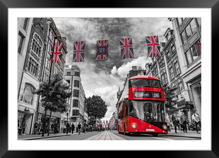 British bus and flags in Oxford Street, London Framed Mounted Print by George Cairns