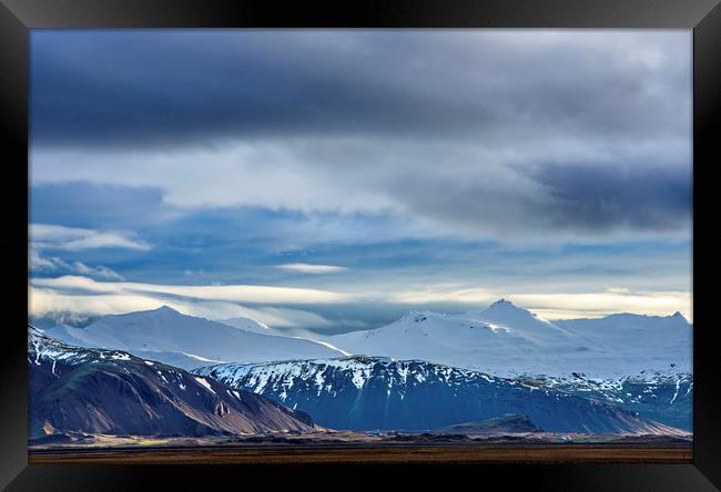 Snow covered mountains south Iceland Framed Print by Nick Jenkins