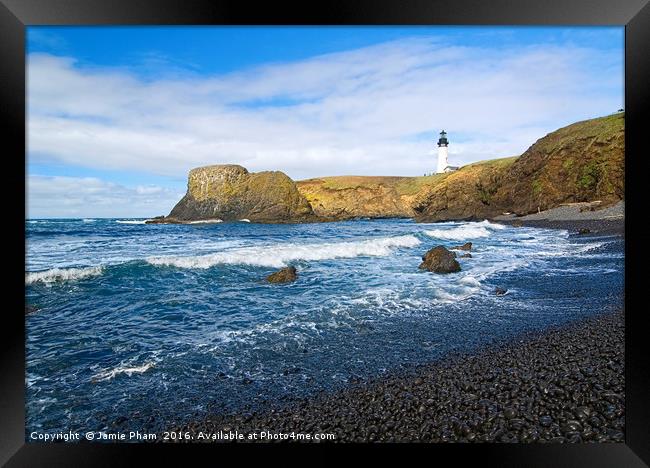 Yaquina Lighthouse on top of rocky beach Framed Print by Jamie Pham