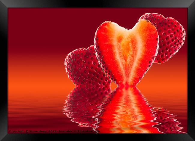 Fresh sliced strawberry in heart shape reflected Framed Print by Steve Heap
