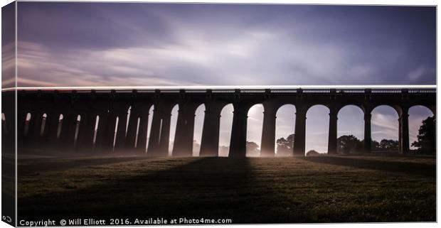 Balcombe Viaduct in the Misty Moonlight at Night Canvas Print by Will Elliott
