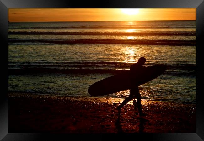 Surfer at sunset Framed Print by Helen Cooke